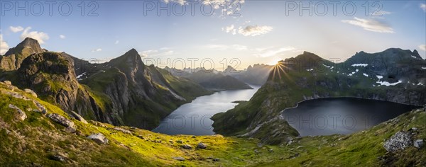 Sun shines over mountain landscape with fjord Forsfjorden and lake Krokvatnet