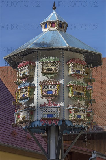 Artfully built dovecote in front of a farmhouse