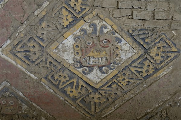 Colourful relief of the Moche culture on adobe walls