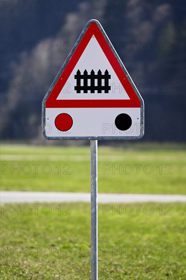 Traffic sign level crossing with barriers and traffic lights