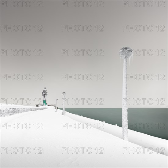 Iced lighthouse in the harbour of Sassnitz