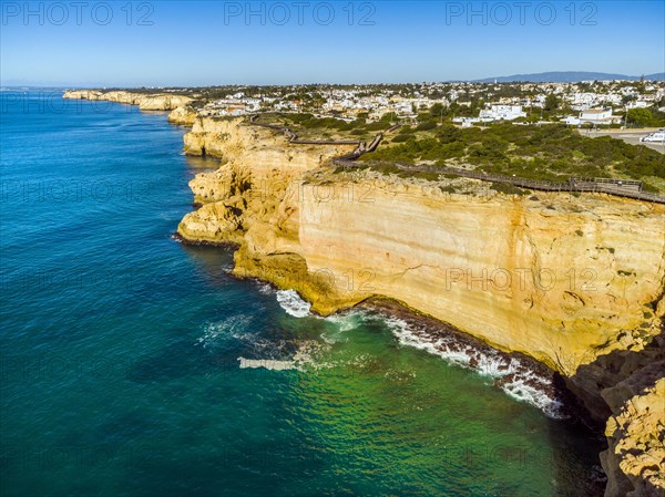 Wooden pathway called Algar Seco Cliff Walk on the coast of Carvoeiro