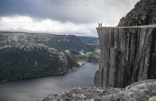 Two people at rock plateau