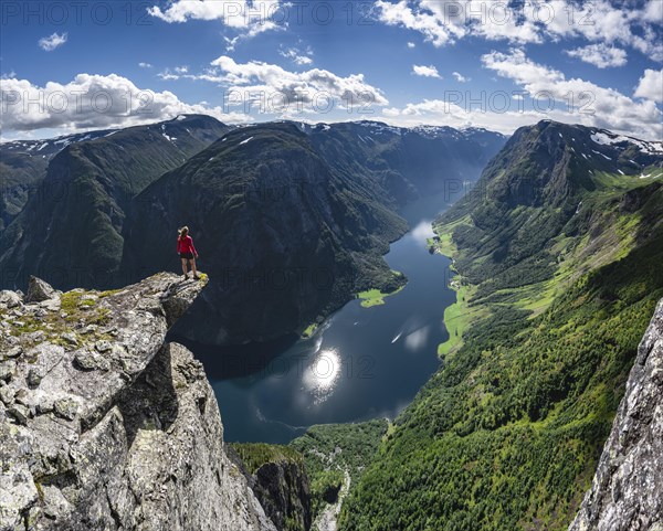 Hiker standing on rocky outcrop