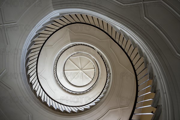 Beautiful winding staircase in old tenement house in Warsaw