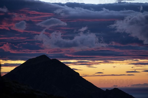 Glowing evening sky over mountain tops