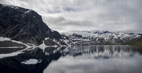 Snow and ice floating on lake Djupvatnet