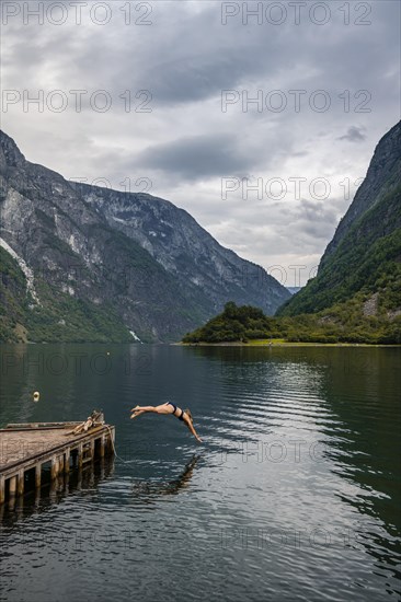 Woman jumping into the water