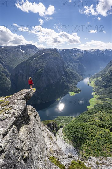 Hiker standing on rocky outcrop