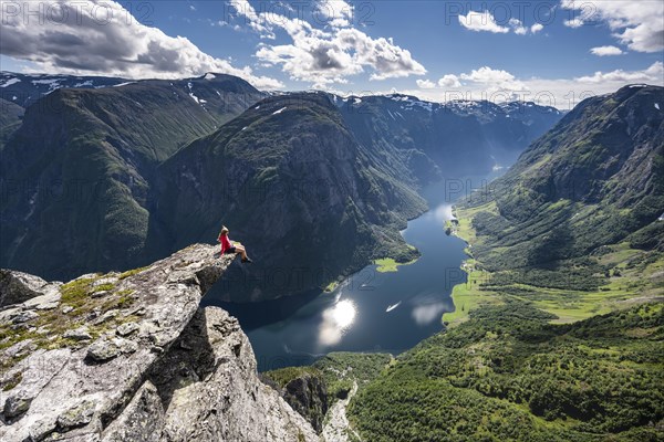 Hiker sitting on rock