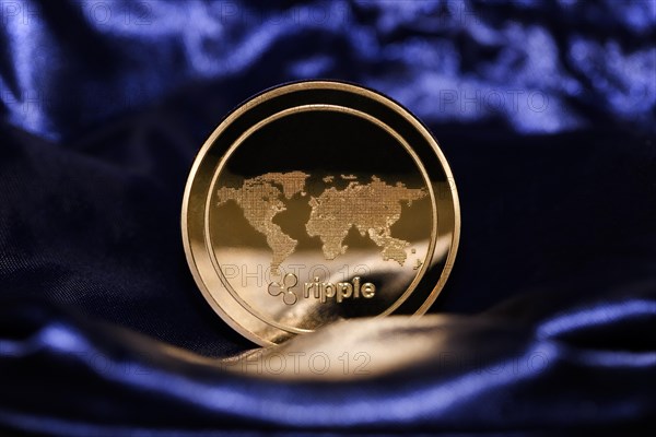 An XRP Ripple on blue velvet