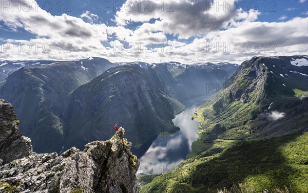 Hiker standing on rocky outcrop