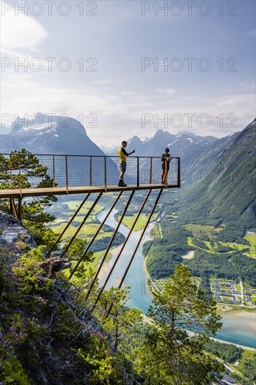 Hikers standing on viewing platform Rampestreken