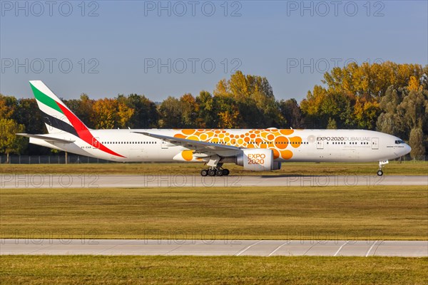 An Emirates Boeing 777-300ER aircraft with registration number A6-ENM and special livery EXPO 2020 Dubai at Munich Airport