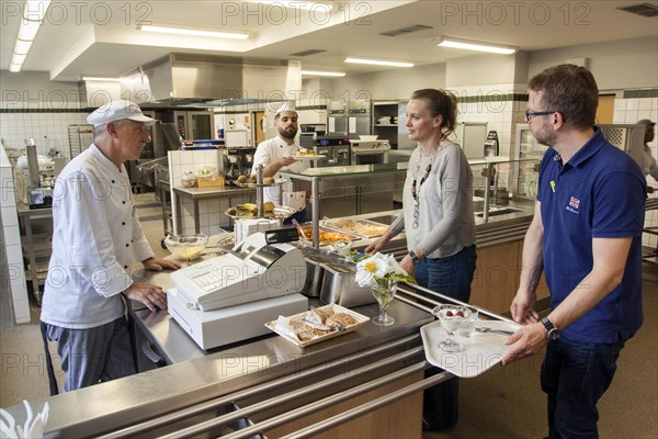 Serving food in a canteen at a vocational college