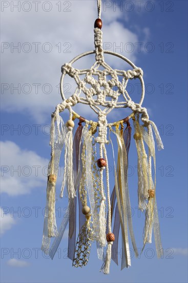 Dreamcatcher in front of blue sky