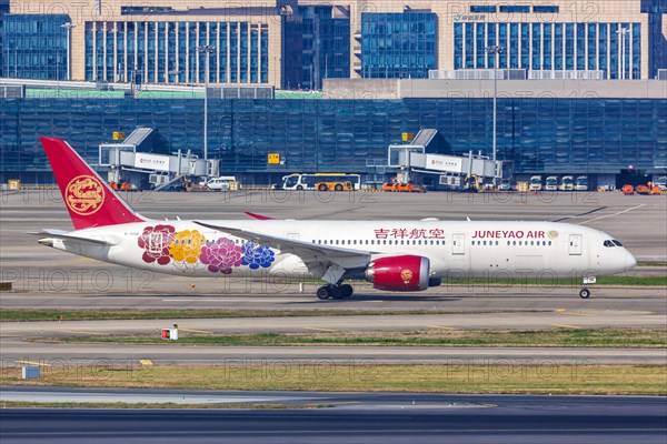 A Boeing 787-9 Dreamliner aircraft operated by Juneyao Air with registration number B-209R at Shanghai Airport