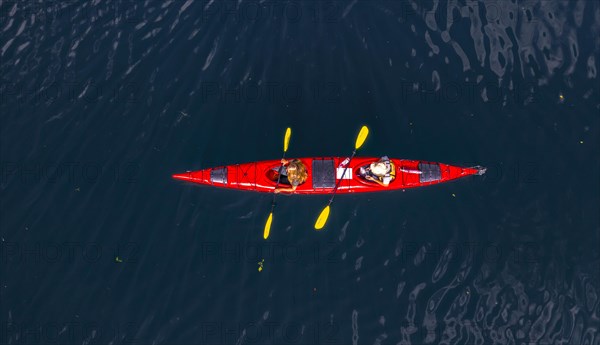 Red kayak in Geirangerfjord from above