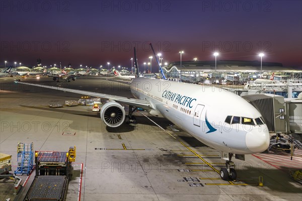 A Cathay Pacific Boeing 777-300ER aircraft with registration number B-KPE at Hong Kong Airport