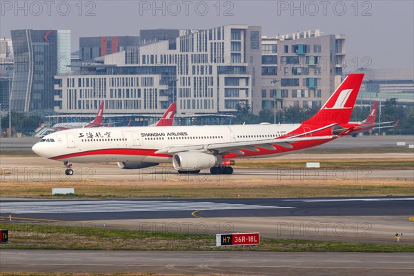 An Airbus A330-300 aircraft of Shanghai Airlines with registration number B-6097 at Shanghai airport