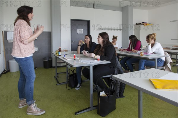 Vocational school students in class of the vocational training to become a beautician. Dual system at the Elly-Heuss-Knapp-Schule