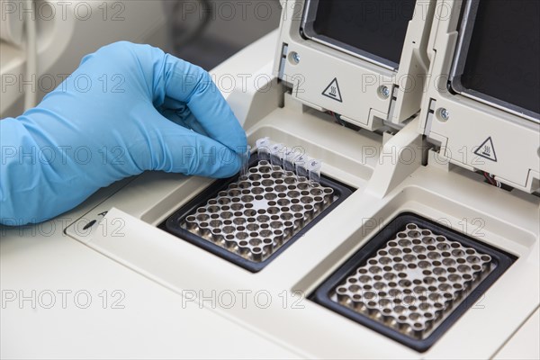 Scientist of biology at the PCR cycler in the genetic engineering section of the laboratories of the University of Duisburg-Essen