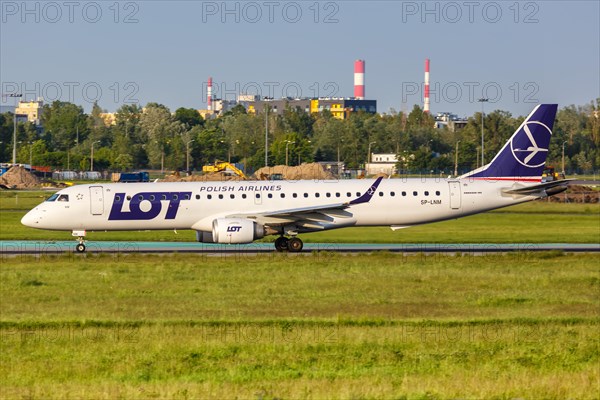 An Embraer 195 of LOT Polskie Linie Lotnicze with registration SP-LNM at Warsaw Airport