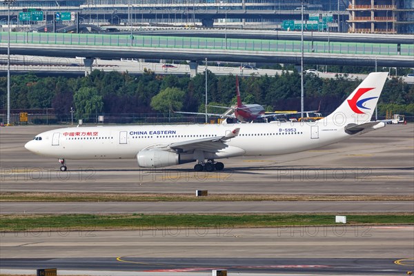 An Airbus A330-300 of China Eastern Airlines with registration number B-5953 at Shanghai Airport