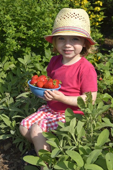 Girl eating strawberries