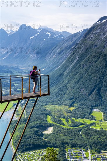 Hiker standing on viewing platform Rampestreken