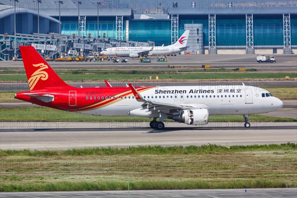 An Airbus A320 aircraft of Shenzhen Airlines with registration number B-8077 at Guangzhou Baiyun Airport