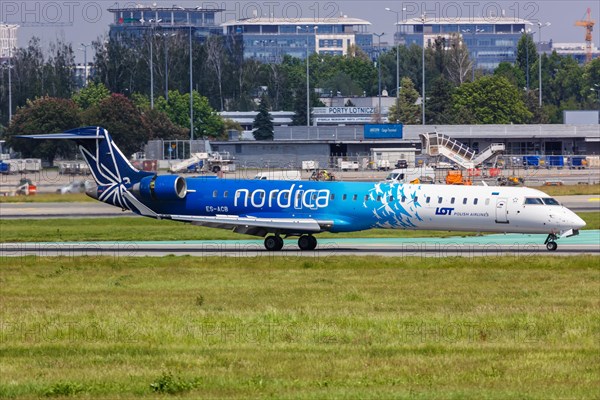 A Bombardier CRJ-900 aircraft of Nordica with registration number ES-ACB at Warsaw Airport