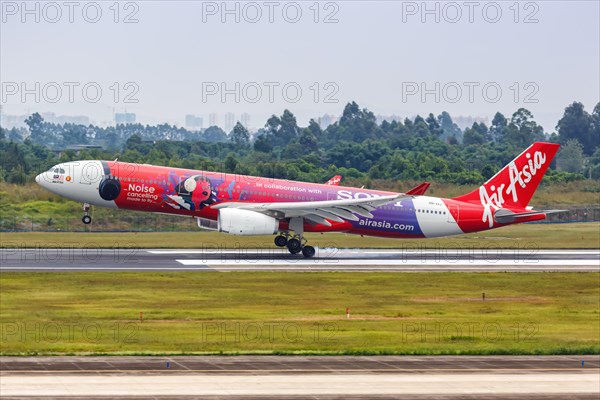 An AirAsia X Airbus A330-300 aircraft with registration number 9M-XXJ in Sony Noise Cancelling special livery at Chengdu Airport