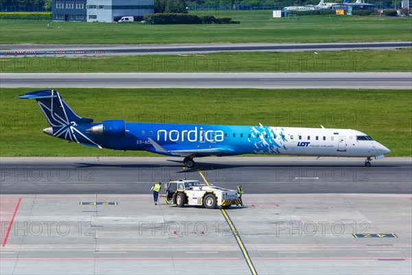 A Bombardier CRJ-900 aircraft of Nordica with registration number ES-ACB at Warsaw Airport