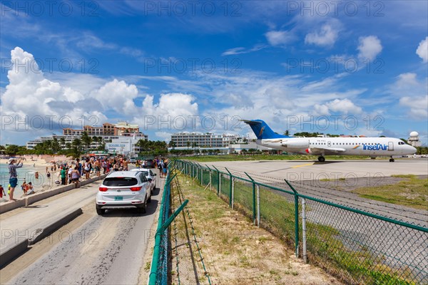 A Fokker 70 of Insel Air with the registration P4-FKC at the airport of St. Maarten