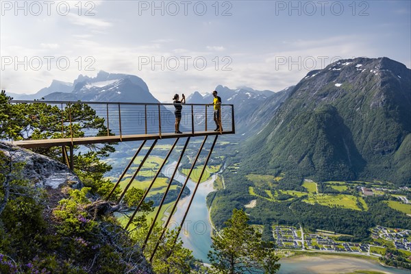 Hikers standing on viewing platform Rampestreken