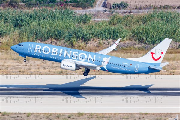 A TUI Boeing 737-800 with the registration D-ATUI and the special livery Robinson at Rhodes Airport