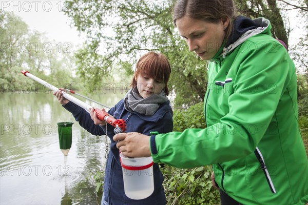 Researchers from Prof. Dr. Jens Boenigk's group at the University of Duisburg-Essen checking water samples near Grietherbusch on the Lower Rhine