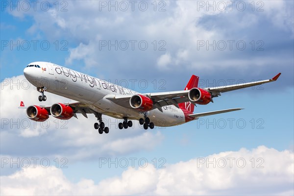 A Virgin Atlantic Airbus A340-600 with registration G-VNAP lands at London Heathrow Airport