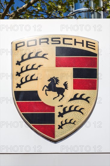 Porsche logo symbol sign headquarters in Stuttgart Zuffenhausen Germany portrait format