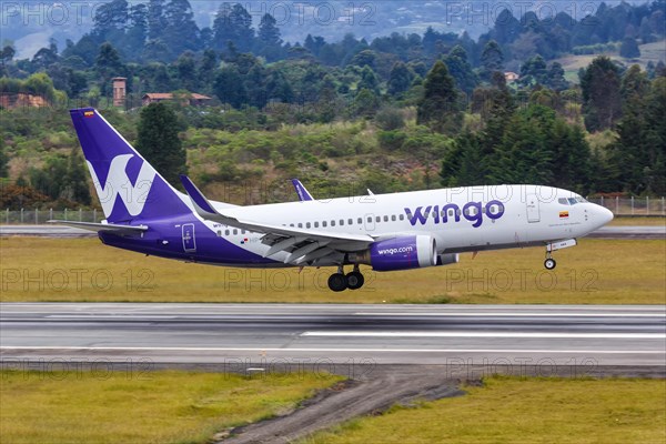 A Wingo Boeing 737-700 aircraft with registration number HP-1525CMP lands at Medellin Rionegro Airport