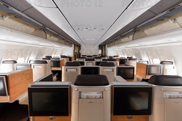 Business class cabin of an Airbus A340-300 aircraft of Swiss at Zurich airport