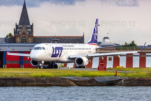 An Embraer 190 of LOT Polskie Linie Lotnicze with the registration SP-LMC at London City Airport