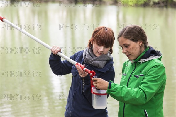 Researchers from Prof. Dr. Jens Boenigk's group at the University of Duisburg-Essen checking water samples near Grietherbusch on the Lower Rhine