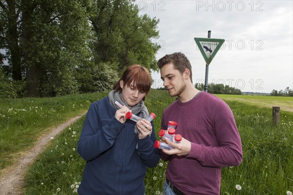 Scientists of the Biodiversity Group of the University of Duisburg-Essen labelling water samples at Grietherbusch in the Lower Rhine region