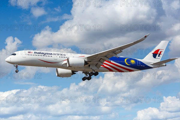 A Malaysia Airlines Airbus A350-900 with registration number 9M-MAC lands at London Heathrow Airport