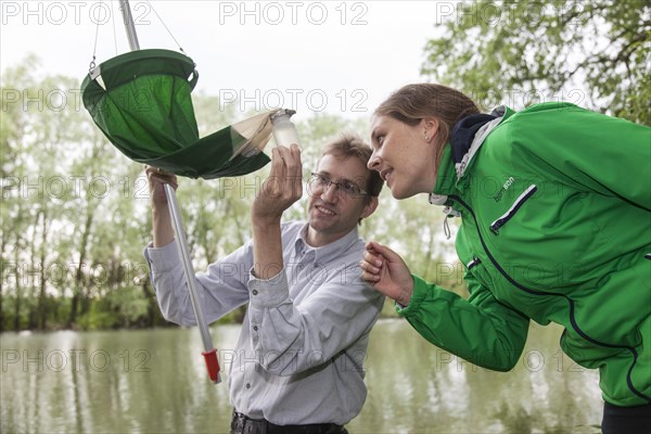 Researchers from Prof. Dr. Jens Boenigk's group at the University of Duisburg-Essen checking water samples near Grietherbusch on the Lower Rhine