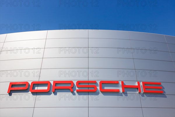 Porsche logo on a car dealership in Stuttgart Zuffenhausen