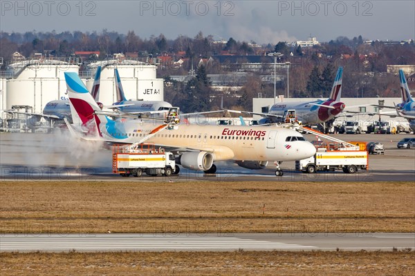 An Airbus A320 of Eurowings with the registration D-AEWR during de-icing at Stuttgart Airport