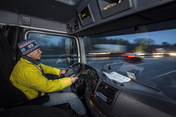 Driving a truck at dawn in winter with poor visibility and road conditions